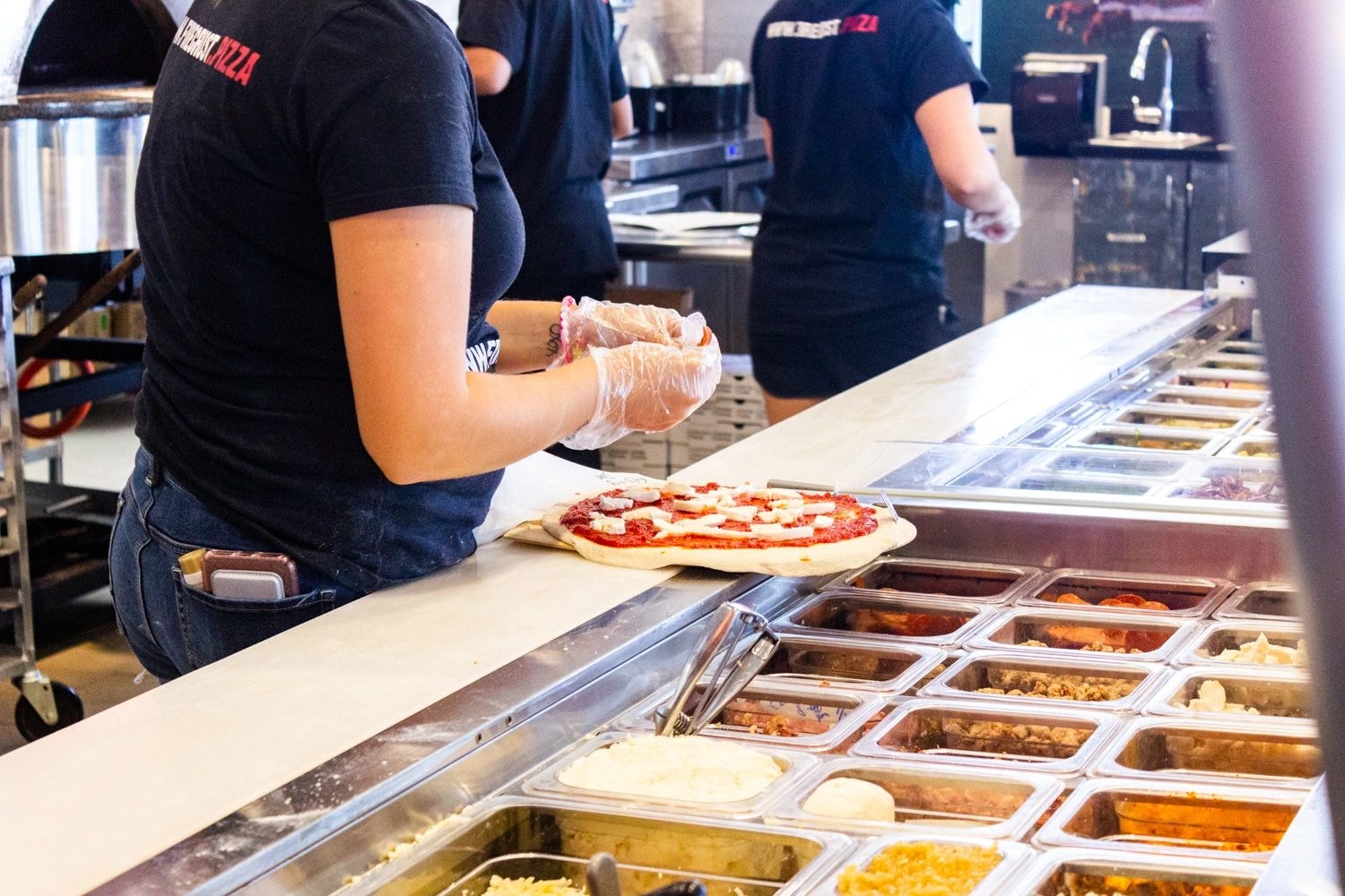 Fire Crust staff making pizza